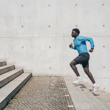 young sportsman running up steps outdoors in berlin