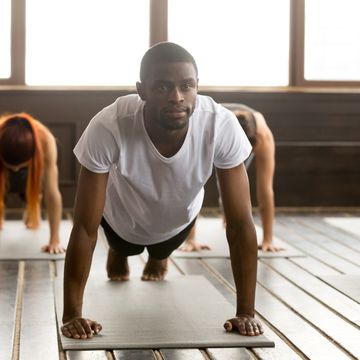 Young sporty black man in Plank pose