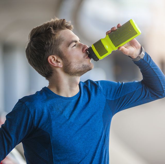 young sporty man with water bottle