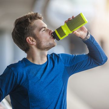 young sporty man with water bottle