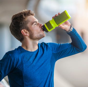 young sporty man with water bottle