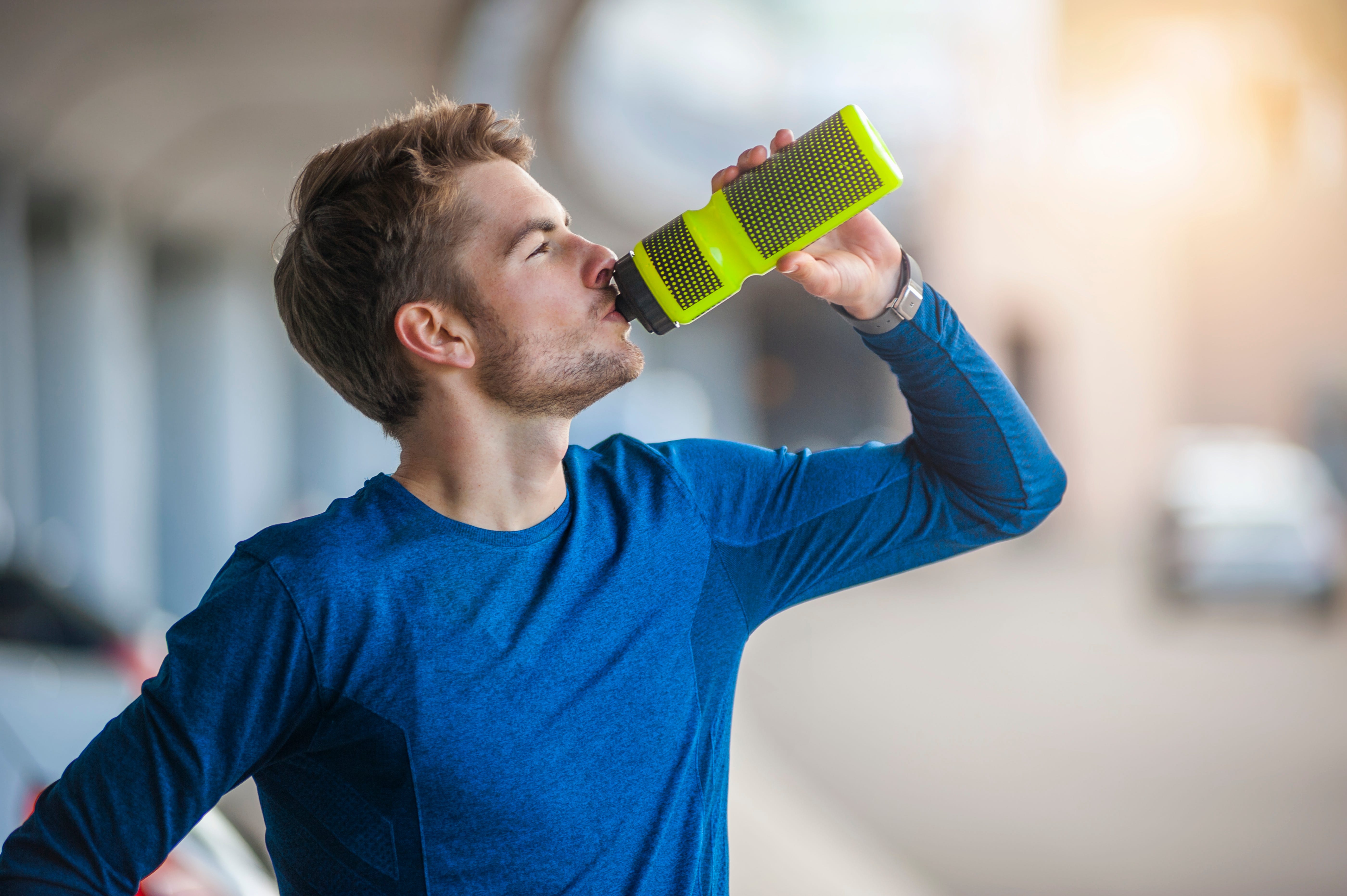 https://hips.hearstapps.com/hmg-prod/images/young-sporty-man-with-water-bottle-royalty-free-image-1627577832.jpg?crop=1xw:0.84541xh;center,top