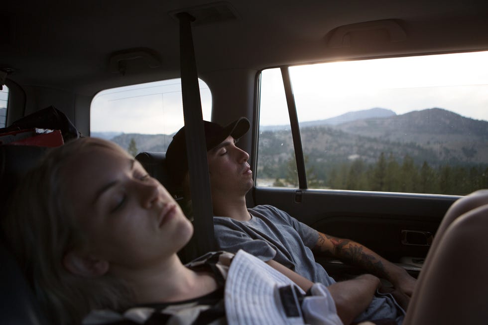 'Young woman and woman asleep in car, Mammoth Lakes, California, USA'