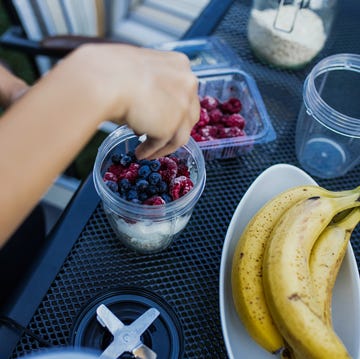 are smoothies healthy Young woman blogging and prepare healthy food