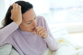 young woman coughing