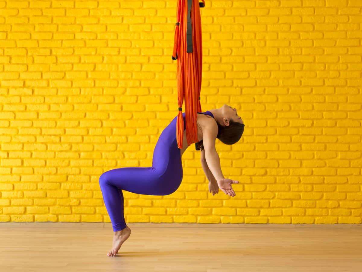 5 Amazing Benefits Of Aerial Yoga That Will Take Your Workout To Another  Level