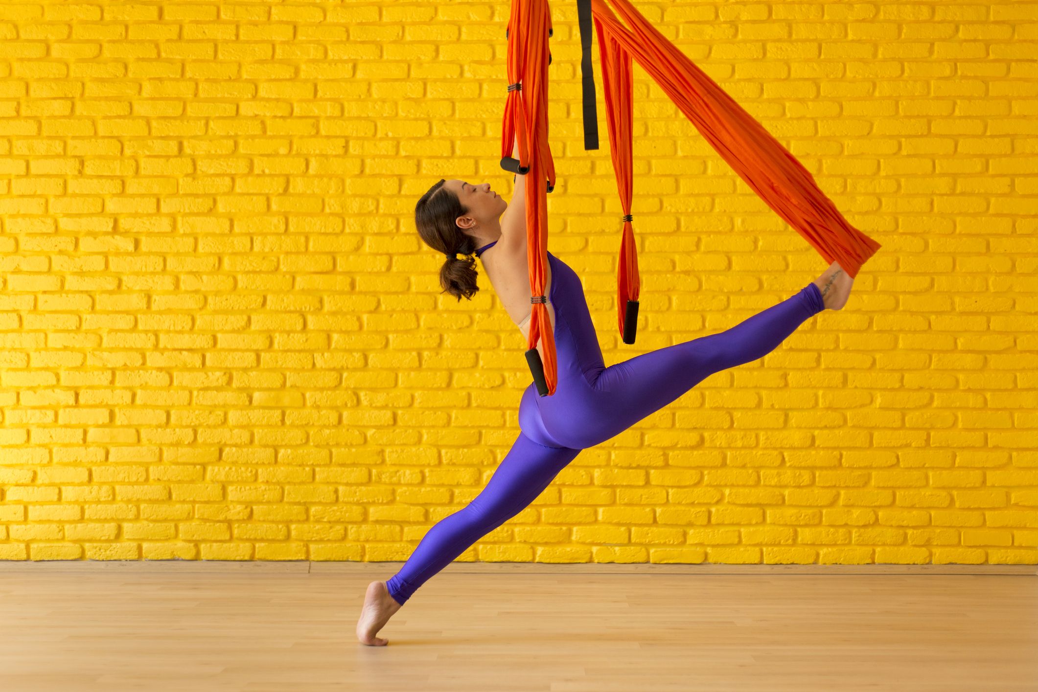 Aerial Yoga: Tips for Beginners, Health Benefits, Poses, and More