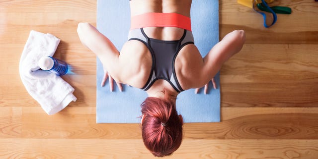 Young woman doing exercise at home.