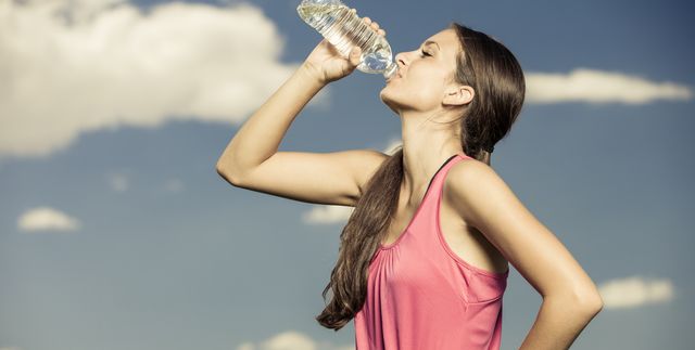 Young Woman Drinking From Water Bottle