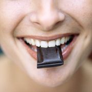 young woman eating chocolate