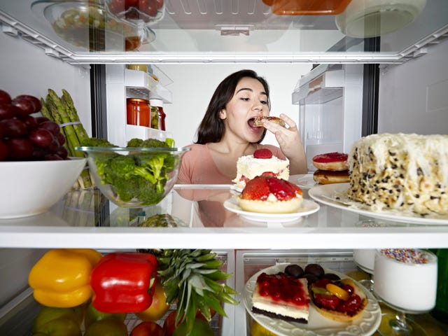 Young Woman Eating Donut