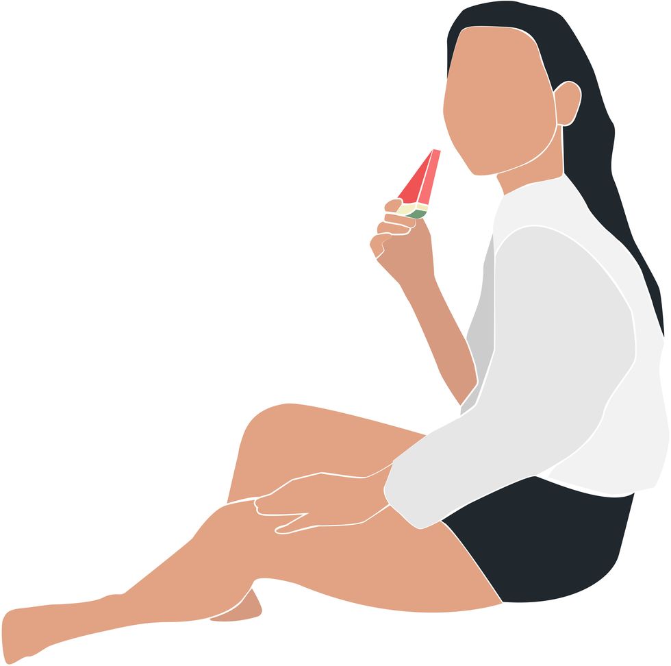 young woman eating watermelon