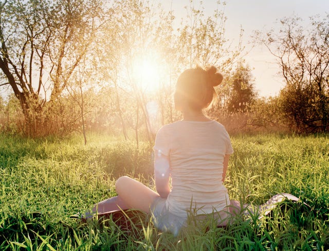 young woman enjoying sunset