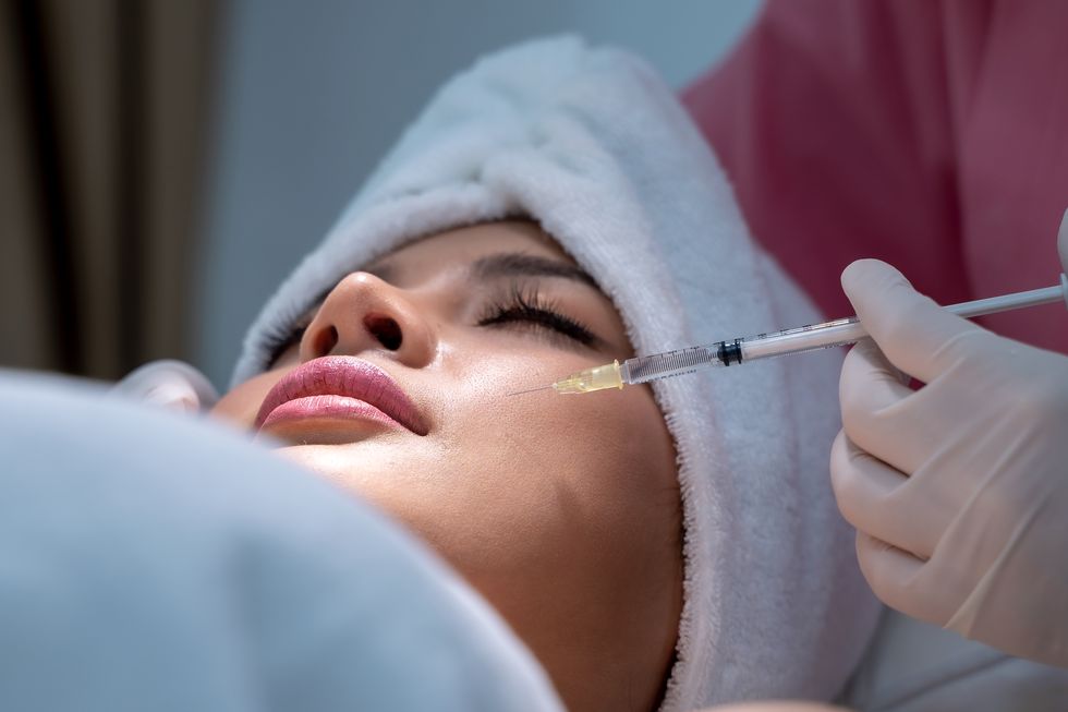 young woman has a botox injections,cosmetology and skin care,plastic surgery clinic