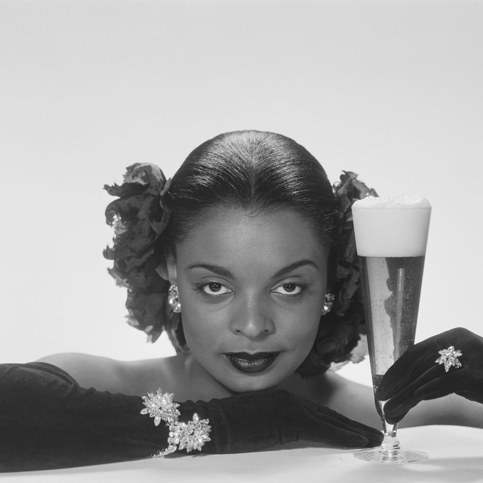 woman in 1950s fashion trends opera gloves