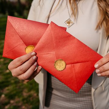 young woman holding envelopes