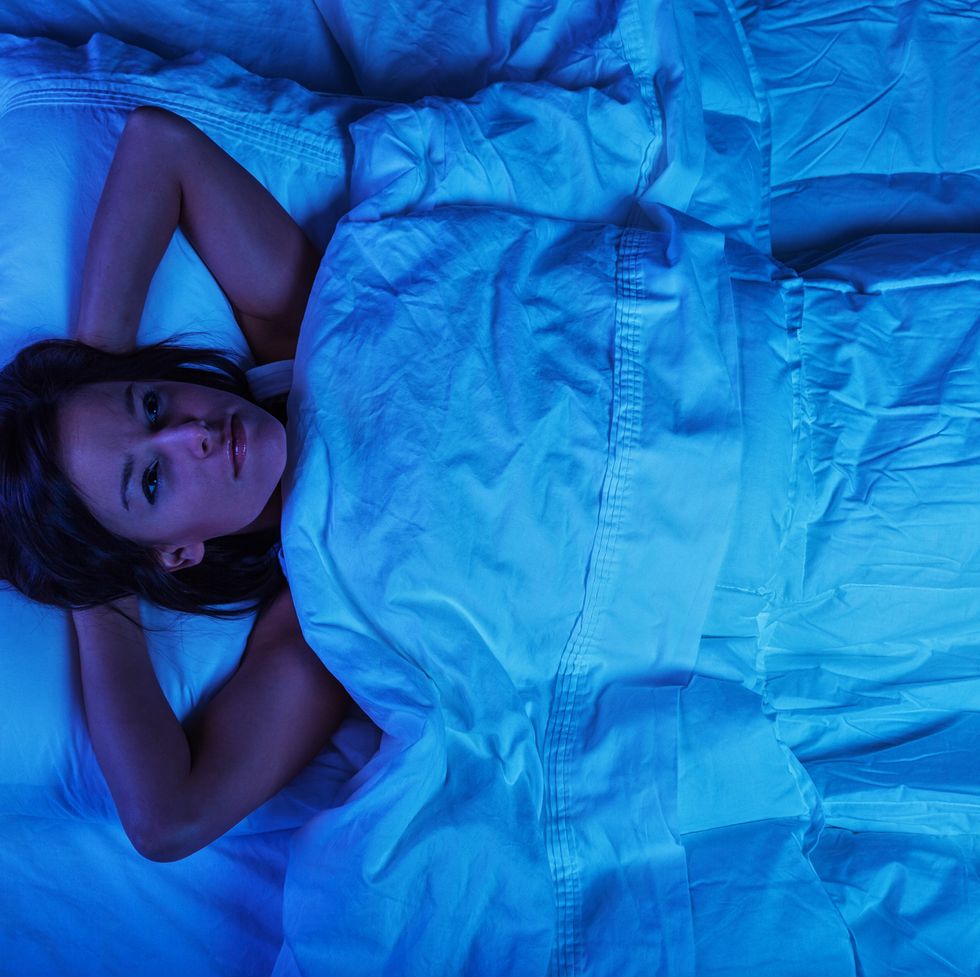 Young Woman in Bed with Insomnia