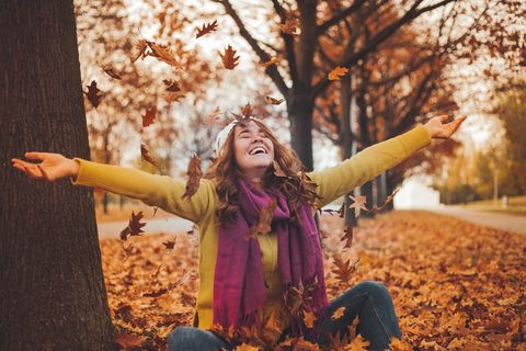 young woman is experiencing autumn and enjoying her free time