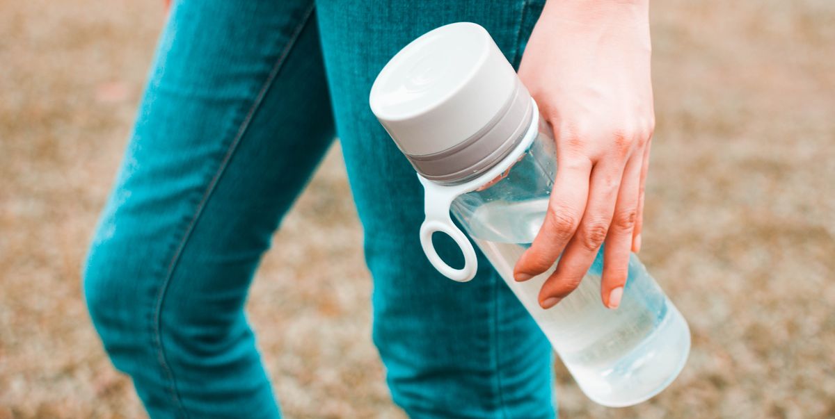 https://hips.hearstapps.com/hmg-prod/images/young-woman-is-holding-a-reusable-water-bottle-royalty-free-image-1703186804.jpg?crop=1.00xw:0.756xh;0,0.133xh&resize=1200:*