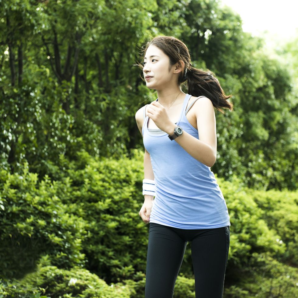 young woman jogging in park