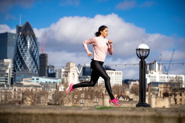 young woman jogging in the city of london