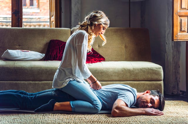 https://hips.hearstapps.com/hmg-prod/images/young-woman-massaging-boyfriend-lying-on-rug-in-royalty-free-image-1613167470.?crop=0.665xw:1.00xh;0.224xw,0&resize=640:*