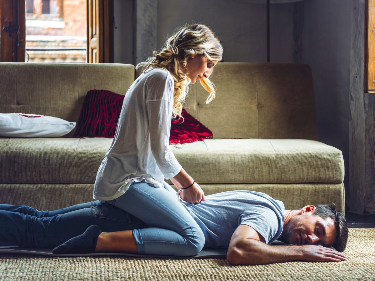 https://hips.hearstapps.com/hmg-prod/images/young-woman-massaging-boyfriend-lying-on-rug-in-royalty-free-image-1613167470.?crop=0.87994xw:1xh;center,top&resize=1200:*