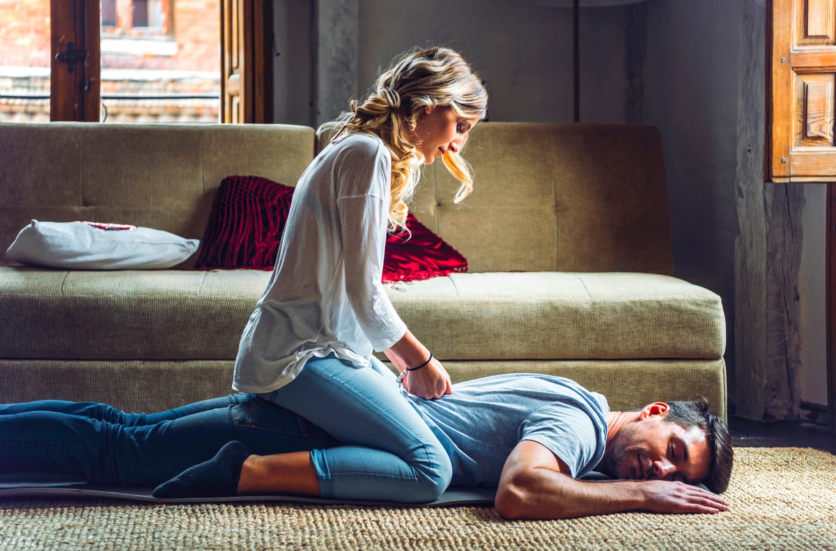 Woman receives a neck and shoulder massage available as Framed