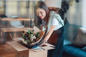 young woman receiving flower delivery