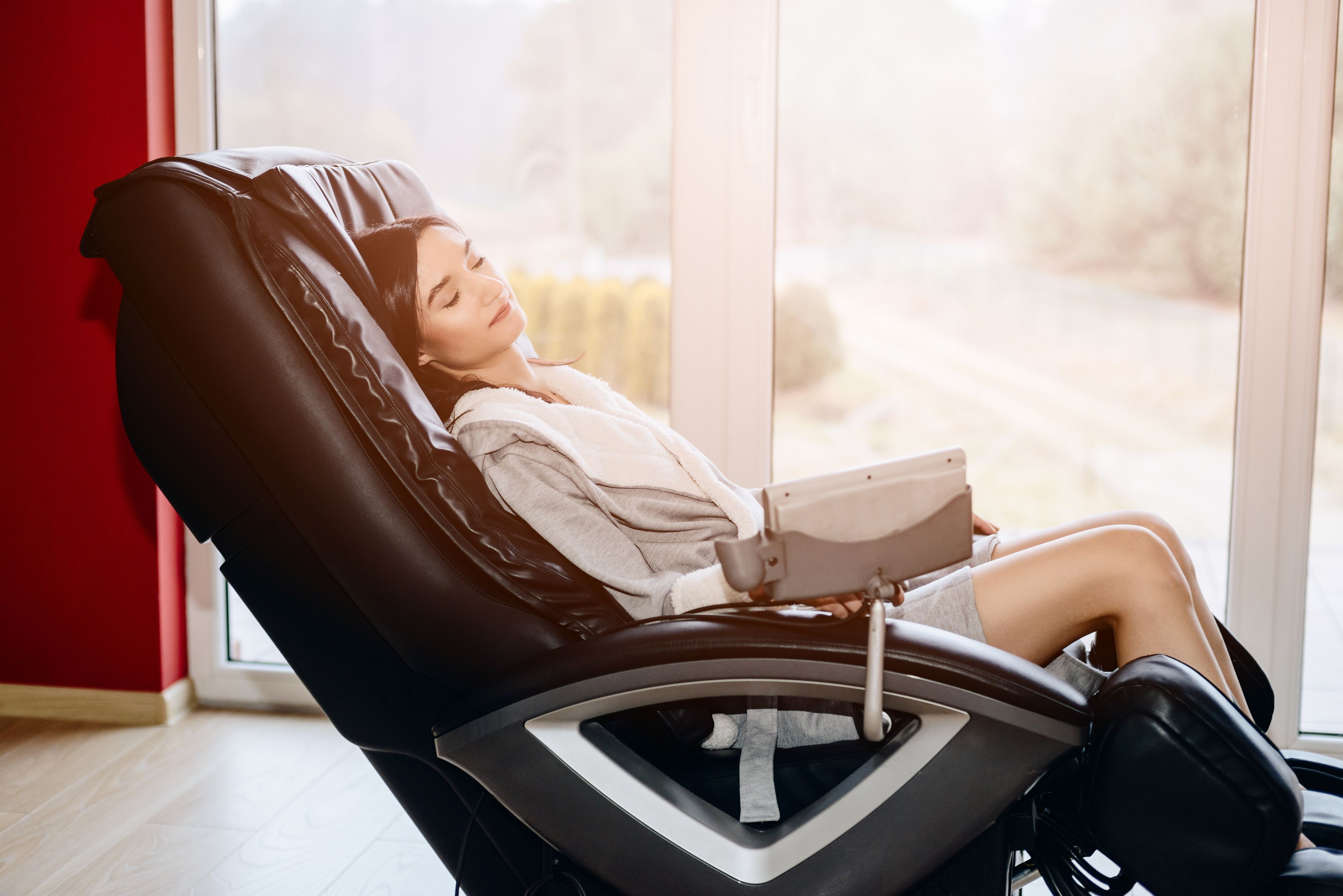https://hips.hearstapps.com/hmg-prod/images/young-woman-relaxing-on-the-massaging-chair-royalty-free-image-1688576898.jpg