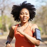 young woman running exercise wearing heartbeat monitoring and smart watch