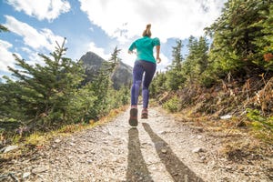 Young woman running in nature