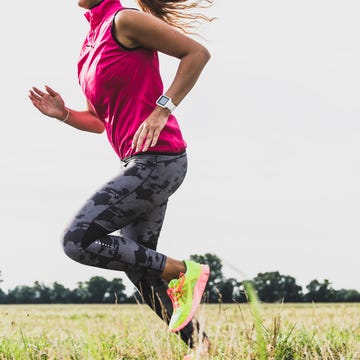 Young woman running in rural landscape Young woman running in rural landscape