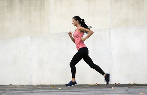 Young woman running in urban setting