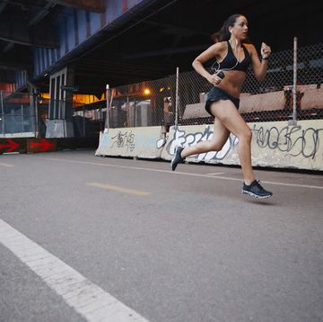 young woman running in urban setting