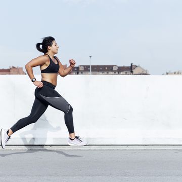young woman running training in the city