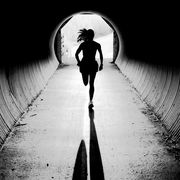 A young woman runs through a tunnel while training in Jackson, Wyoming.