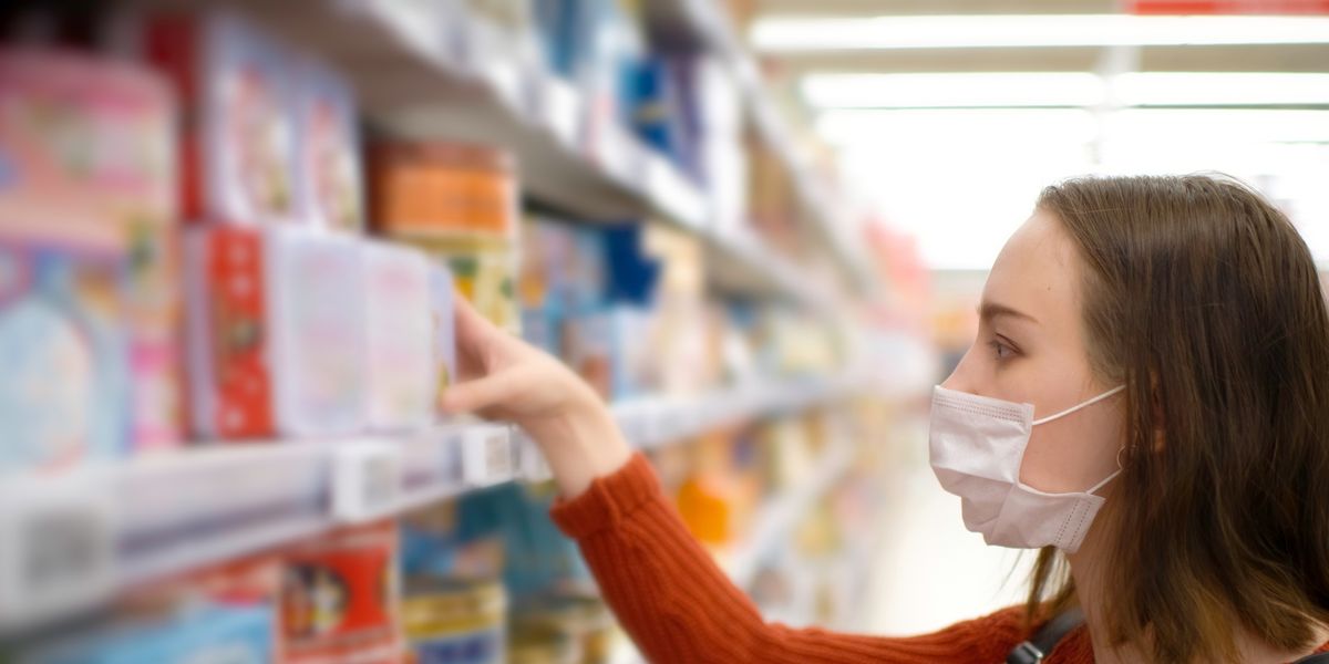 Shopper Wearing Face Mask Walks Past Editorial Stock Photo - Stock
