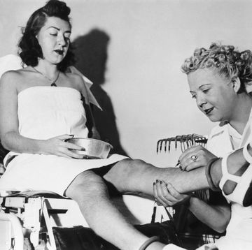 young woman getting hair removal in new york 1938