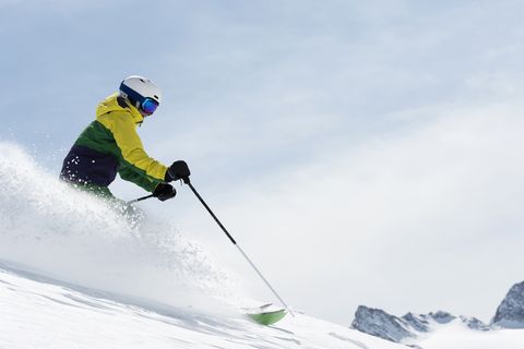young woman skiing downhill, obergurgl, austria