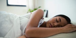 young woman sleeping in bed