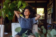 young woman spending a relaxing day in her beautiful home