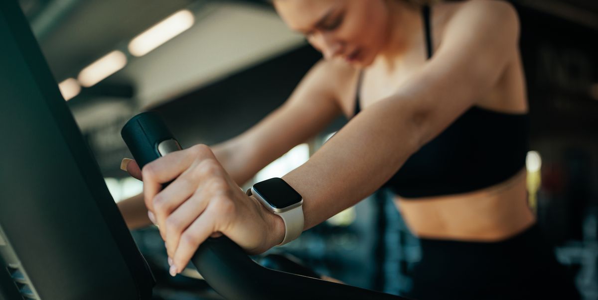 https://hips.hearstapps.com/hmg-prod/images/young-woman-training-on-exercise-bike-wearing-smart-royalty-free-image-1757068248.pjpeg?crop=1.00xw:0.753xh;0,0&resize=1200:*