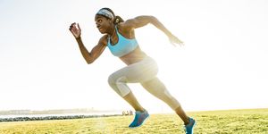 young woman training, sprinting at coast, downtown san diego, california, usa