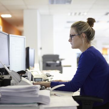 young woman using computer in office