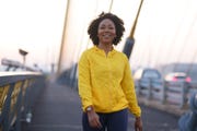 young woman walking exercise in city street