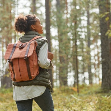Young Woman with Backpack Outdoors young woman with backpack outdoors