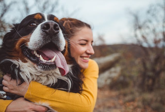 best dog perfumes young woman hugging her dog