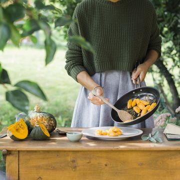 young woman with homemade pumpkin gnocchi, partial view