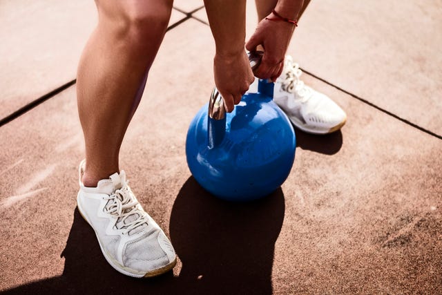 young woman with kettle bell